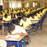 Secondary school students writing examination