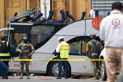 Officials at the scene where Train crashes into double-decker in Mexico