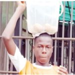 boy carrying a bucket of buns on head my parents were struggling to survive