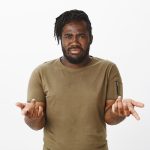 Are you kidding me. Frustrated doubtful plump african-american man with beard, pointing with index fingers at camera, frowning and feeling intense, being unsure and questioned over gray wall
