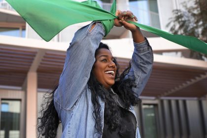 medium-shot-woman-protesting-outdoors