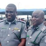 Assistant Comptrollers of Customs, Hameed Bukoye and Jerry Attah pose with their new rank on Tuesday
