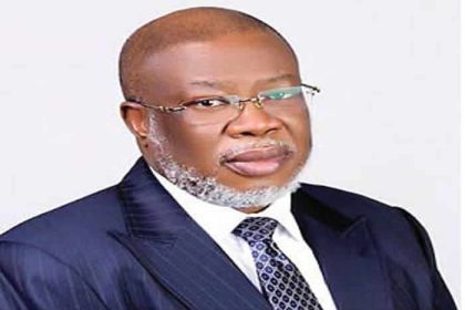 Dr Ehiogie West-Idahosa on black suit