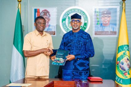 The NIS management team, led by the Director-General, Comrade Philip Shaibu, in a handshake with Ogun State Governor, Dapo Abiodun