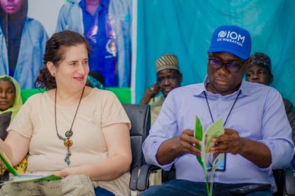 UNICEF representative and Borno governor in a meeting on children of Boko Haram survivors sitting