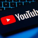 YouTube logo on a laptop keyboard