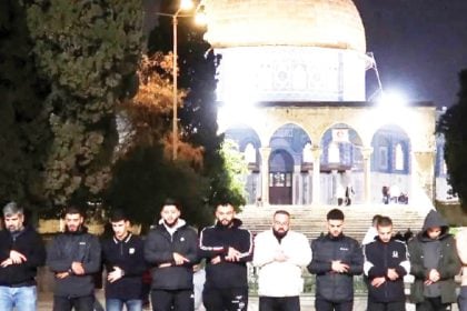 Muslim worshippers pray in front of the Dome of the Rock at Al-Aqsa compound in Jerusalem, on Thursday.