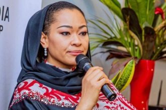 Senator Natasha addressing a crowd of audience