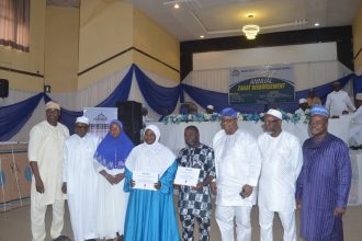 From left, General Manager, Nasrul Lahi l Fatih Society Agency for Zakat and Sadaqat (NAZAS), Alhaji Mufutau Adelotan; director representing the board chairman, Alhaji Abdurrahman Abdulwahab; Director, Alhaja Fausiyah Adegeye; beneficiaries, Lateefah Vintura and Shukrullahi Ajitena; immediate past board chairman, Alhaji Hafiz Bakare; NASFAT Vice President II, Alhaji Moroof Ajiroba; and General Manager, HAVEK Leadership Academy, Mr Abdulwasiu Ayoola, at the 1447AH/2026 zakat disbursement programme organised by NAZAS, held on Sunday at the Lagos State Secretariat Mosque Hall, Alausa, Ikeja.