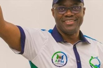 Makinde appoints zonal coordinators Gov Seyi Makinde smiling while fluanting his APM campaign shirt