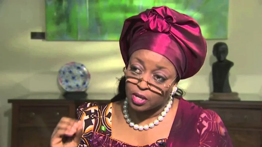 Alison-Madueke gesticulating while addressing the press