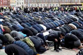 Muslims performing solat