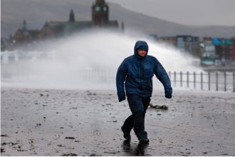 Waves crash over the promenade during Storm Boelo on Sunday in Largs, Scotland.