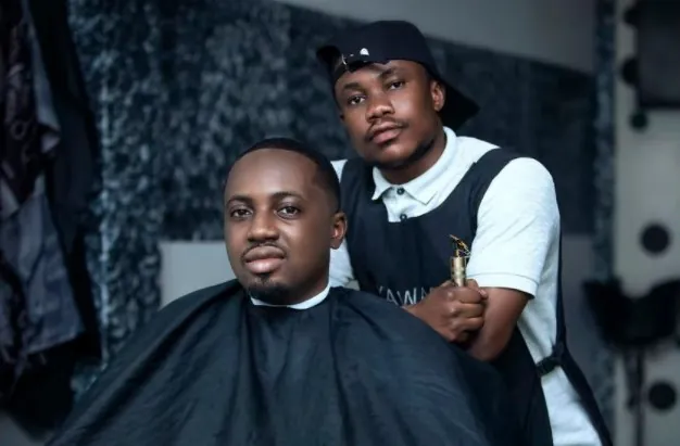 Man having a haircut. This is the first process on how to get waves