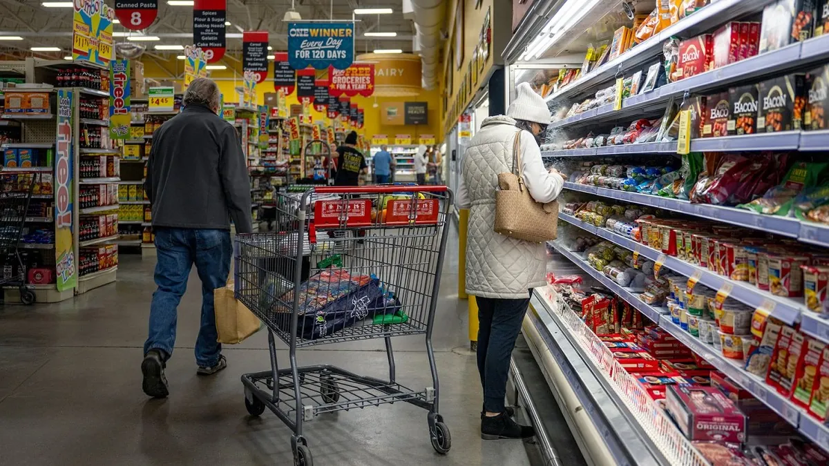 A picture showing US consumers at a supermarket amid surge in prices due to inflation,