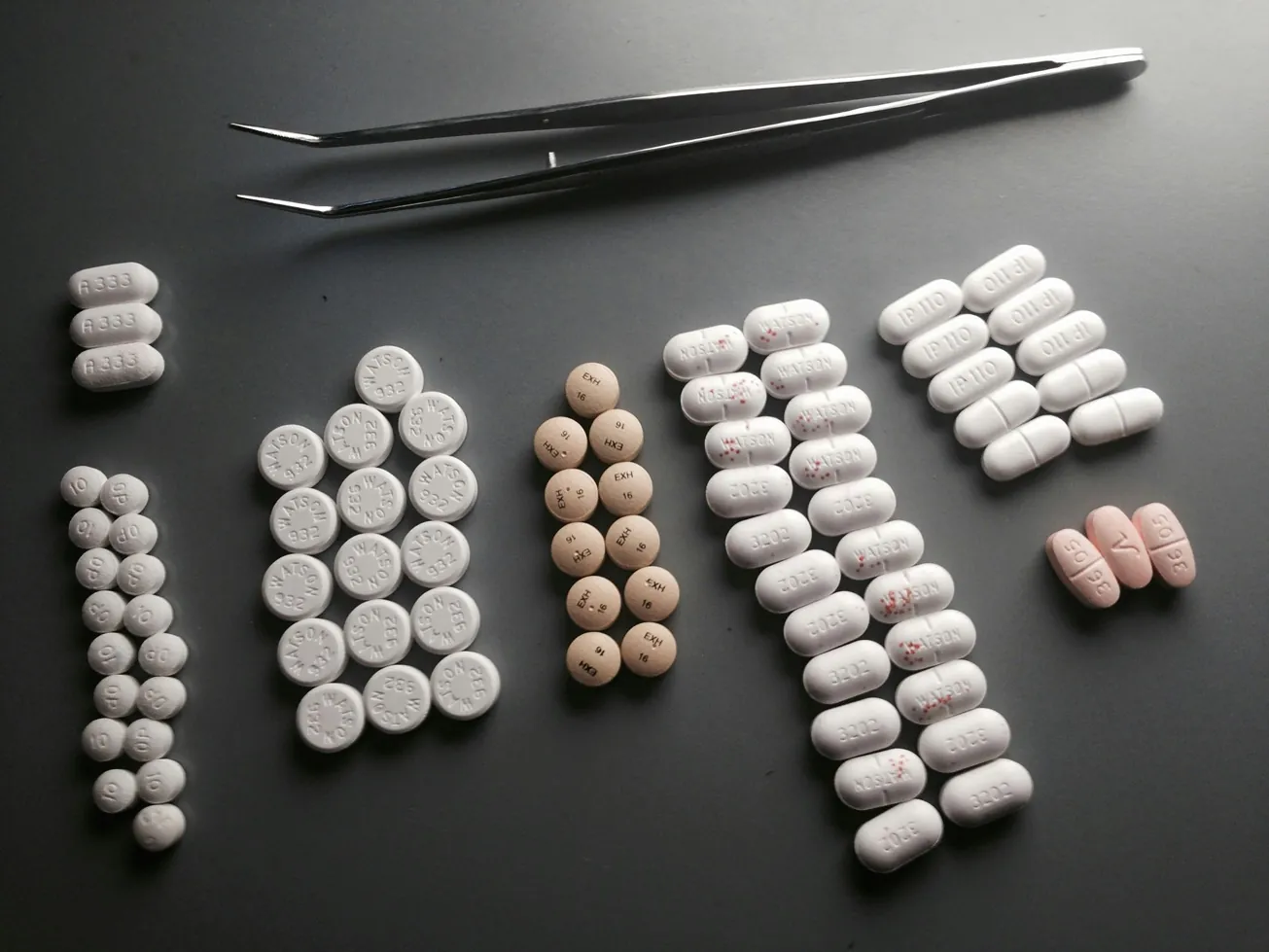 medicine of different shapes sizes and milligrams on a flat surface