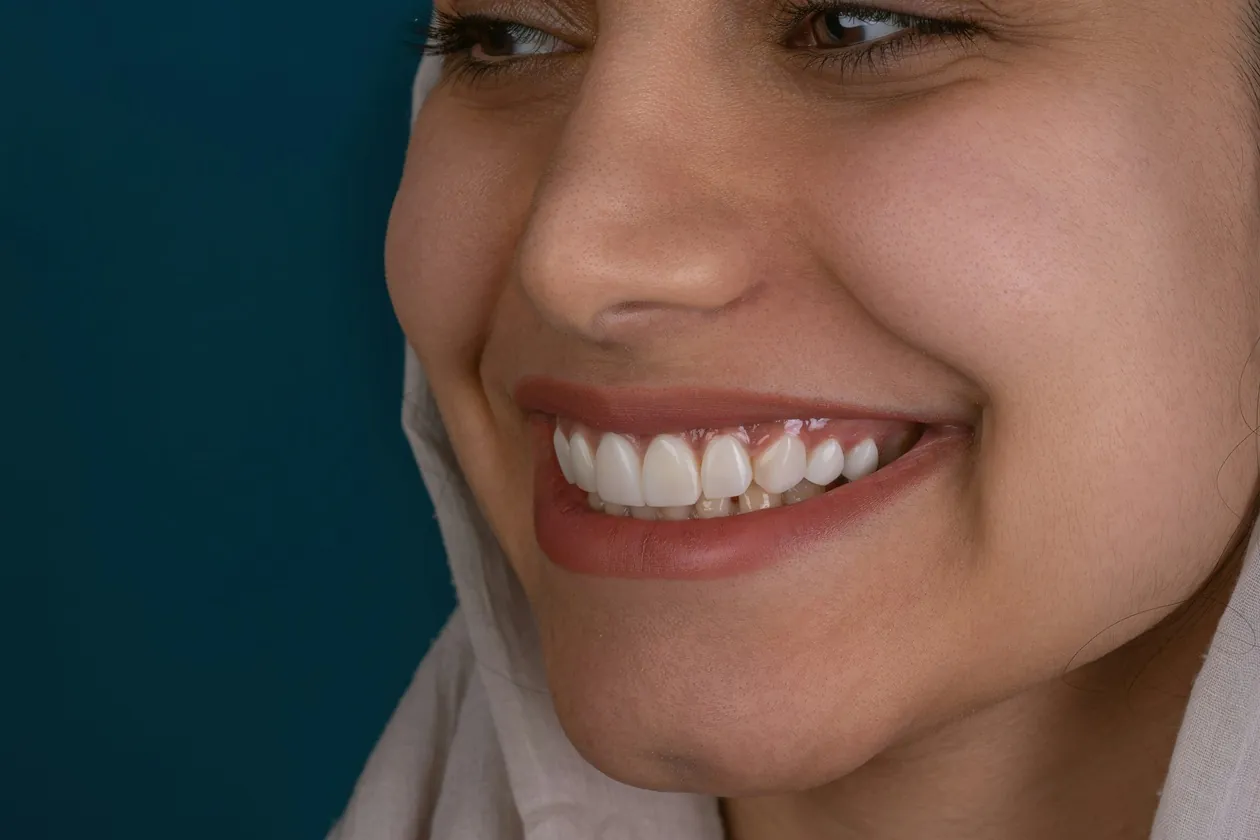 the face of a smiling woman