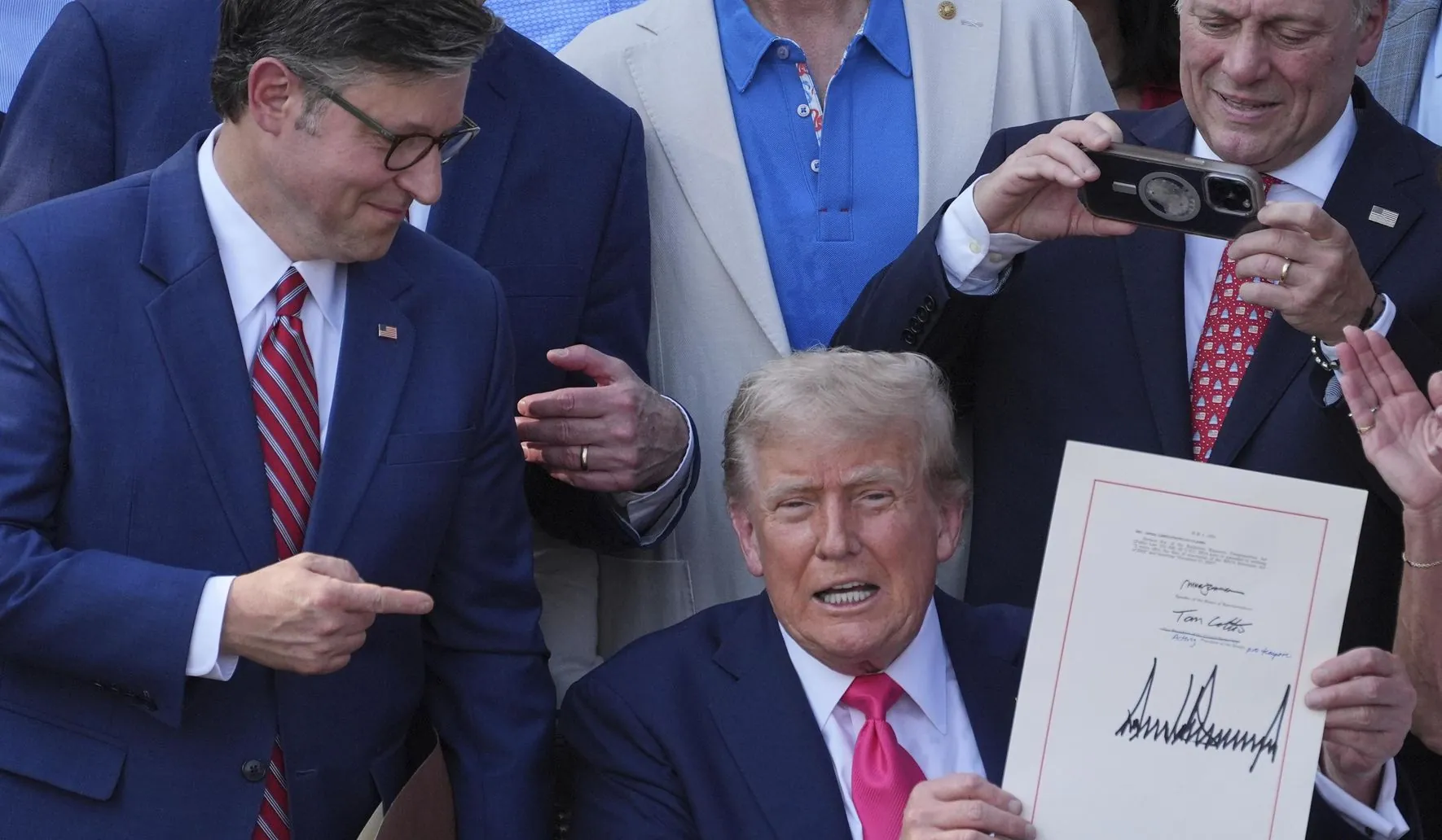 President Donald Trump and Republican lawmakers during the signing of the US tax and spending bill into law at the White House,